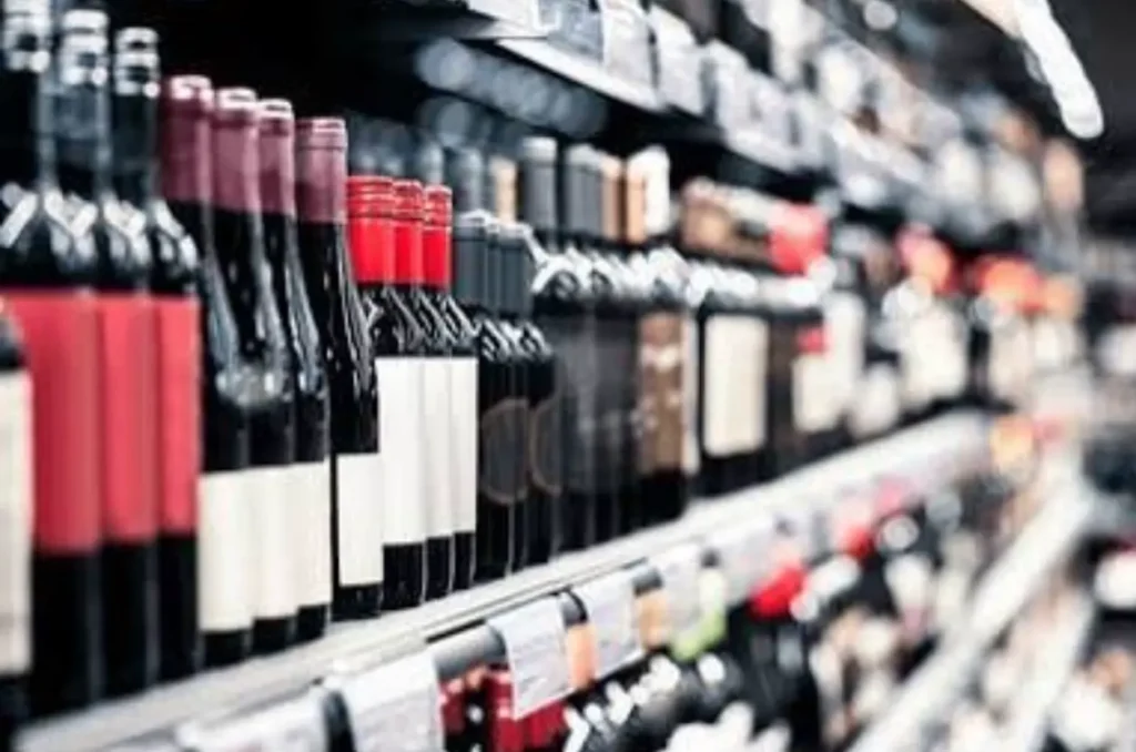 Different sizes of wine bottles on the shelf